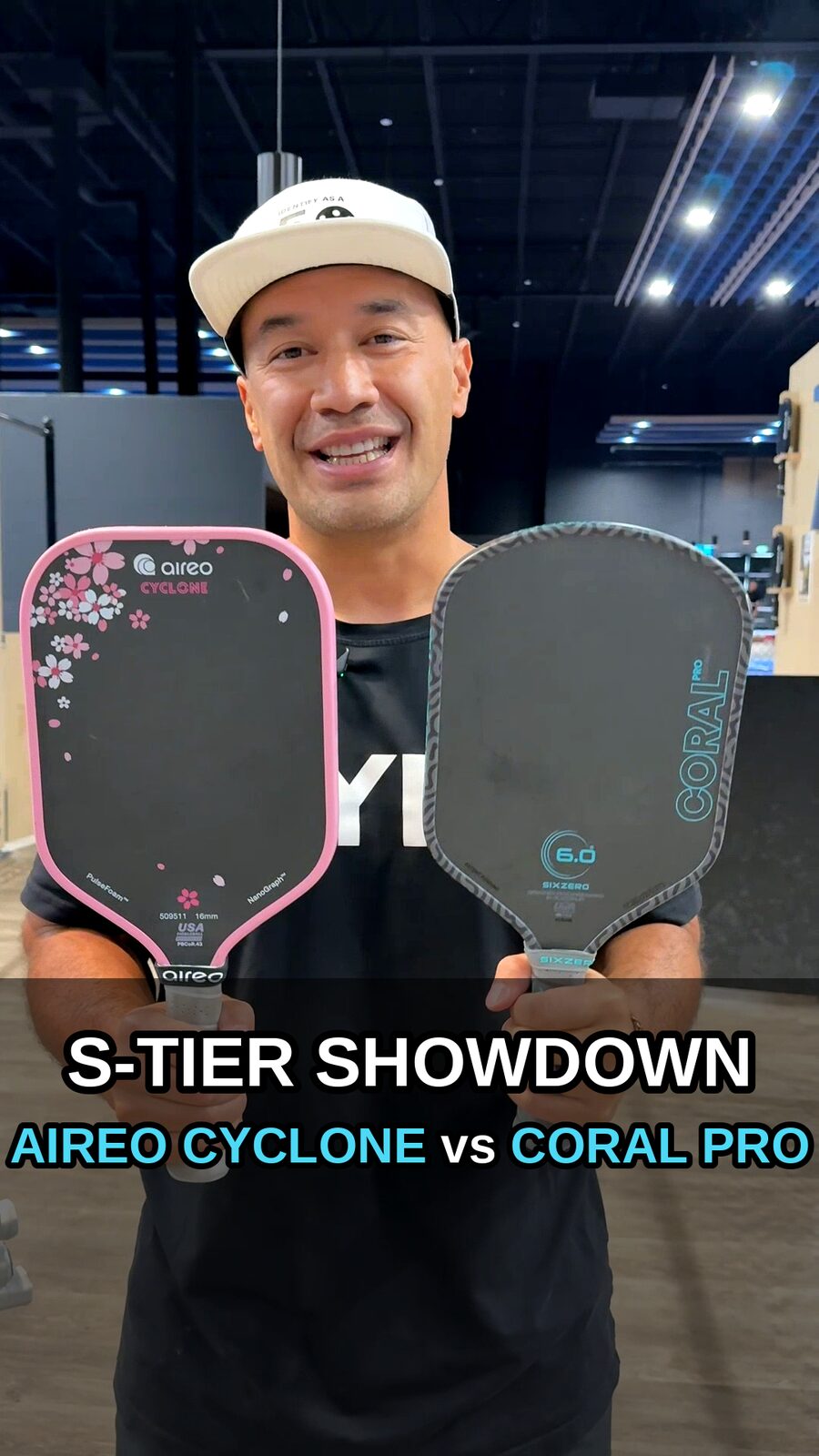 Samson holding the Aireo Cyclone and Six Zero Coral Pro paddles, S-Tier Showdown comparison